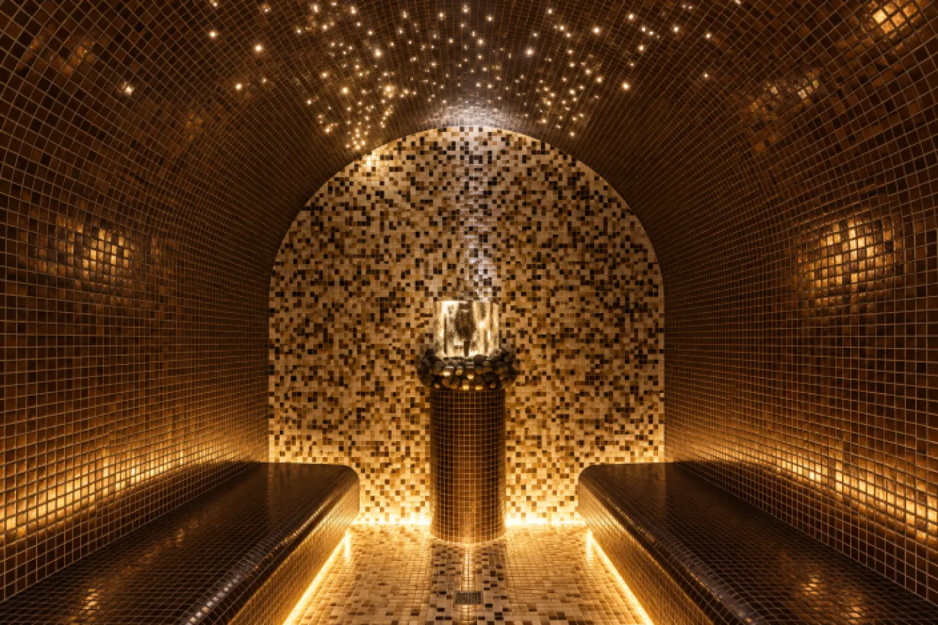 A beautiful, tiled, well-lit steam sauna