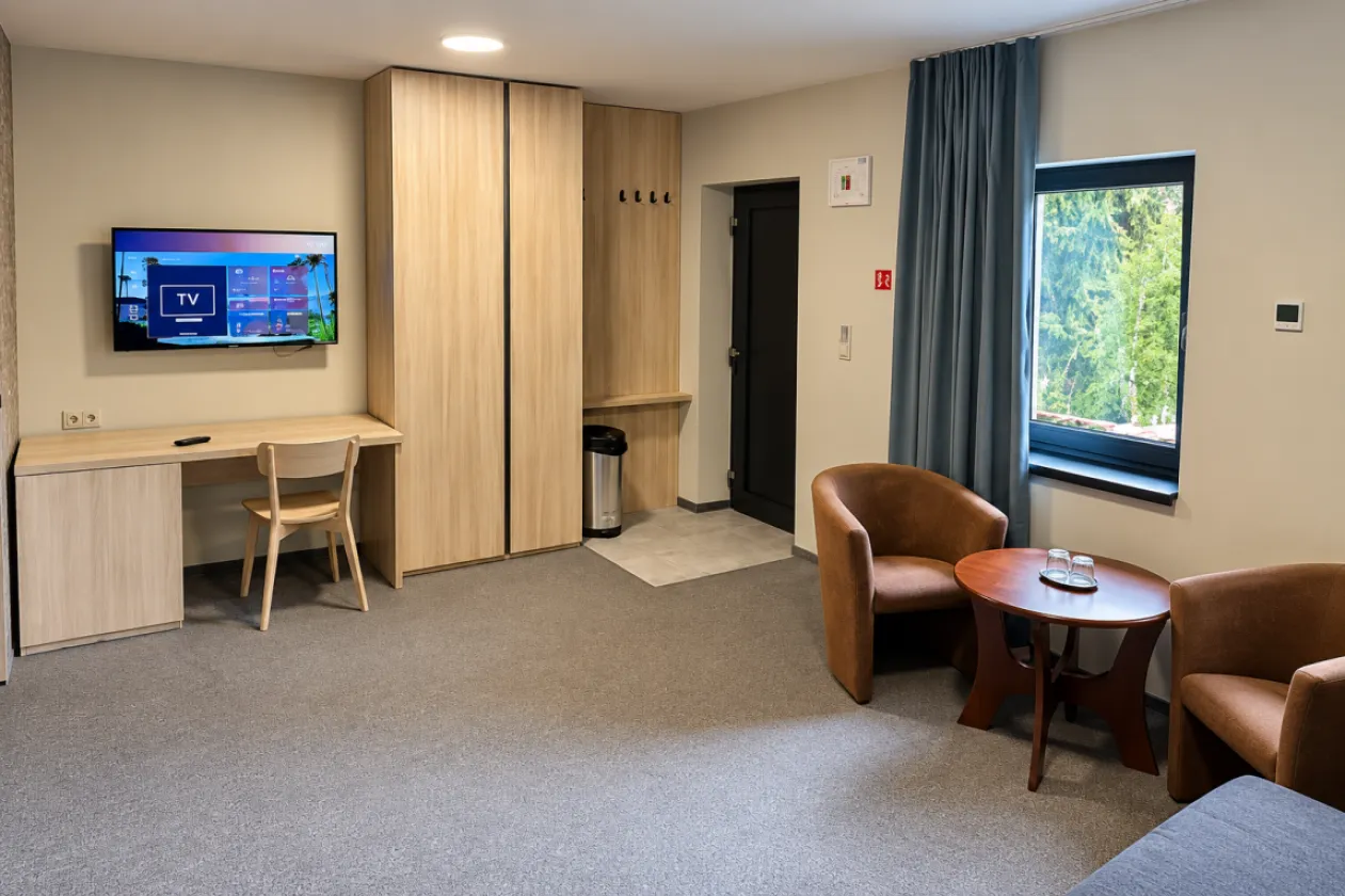 An apartment in the apartment house with a double bed and an opening through to the living area